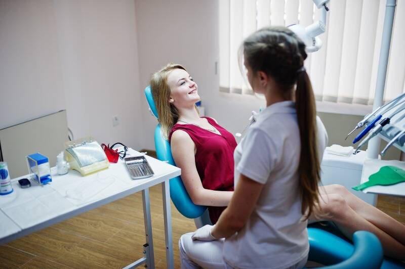 Patient talking with a dentist during a consultation