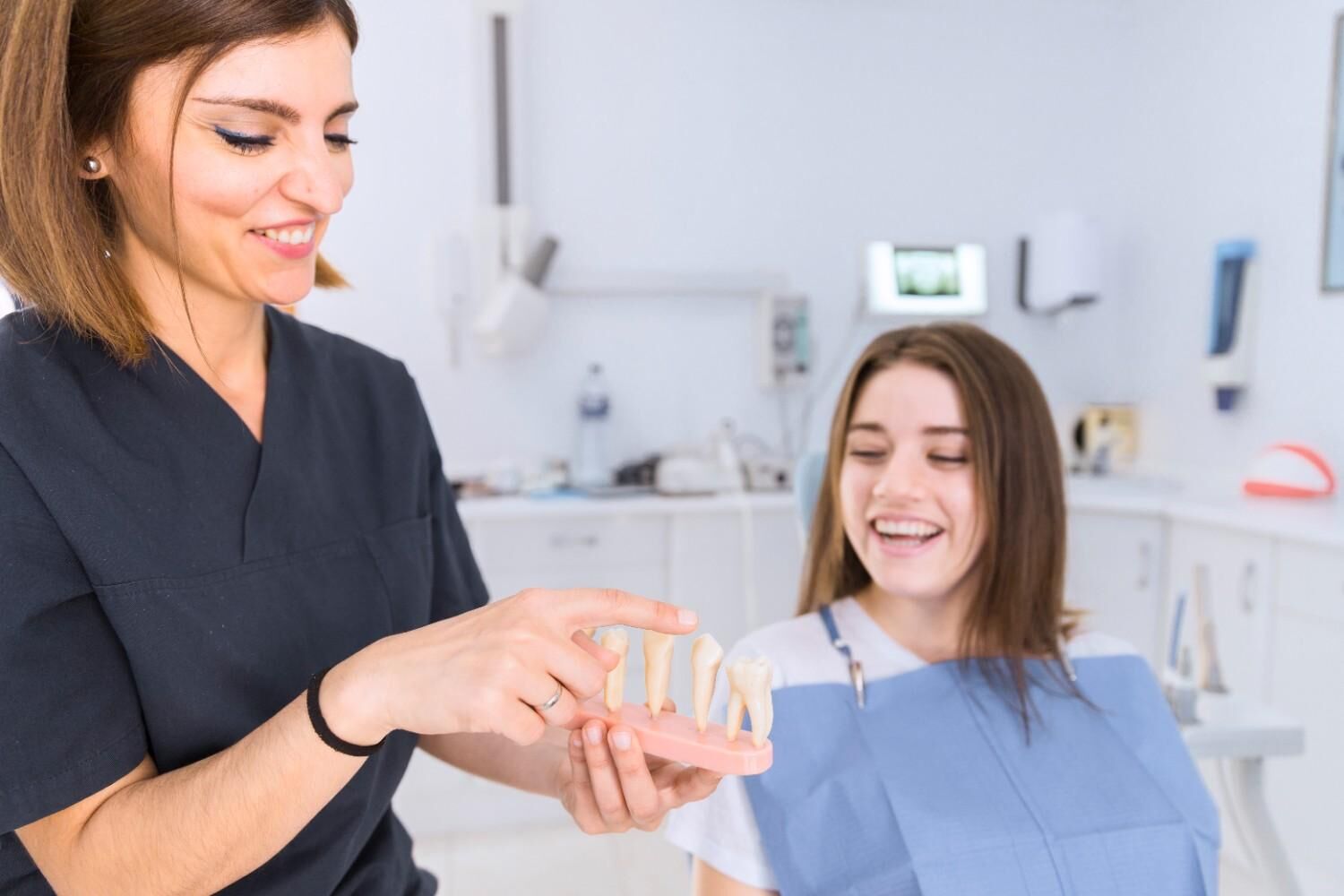 Dental professional explaining oral hygiene